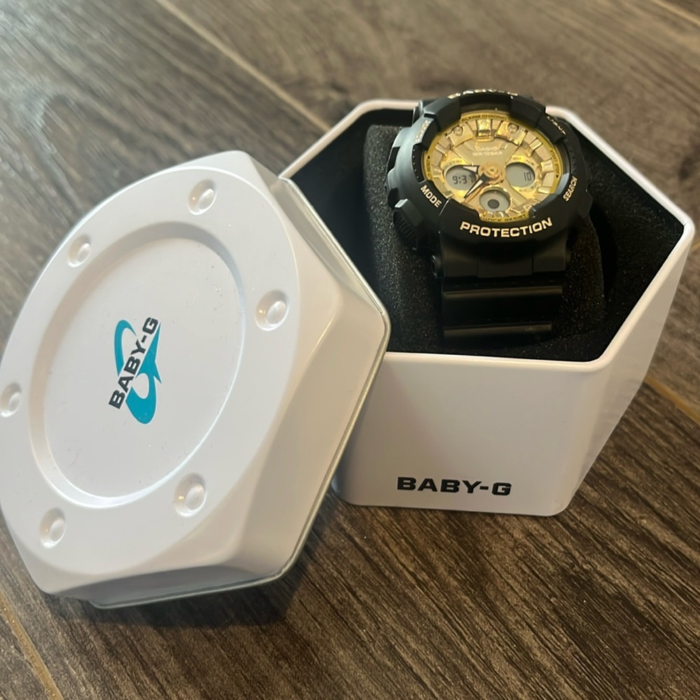 Black and gold Baby G Shock watch.